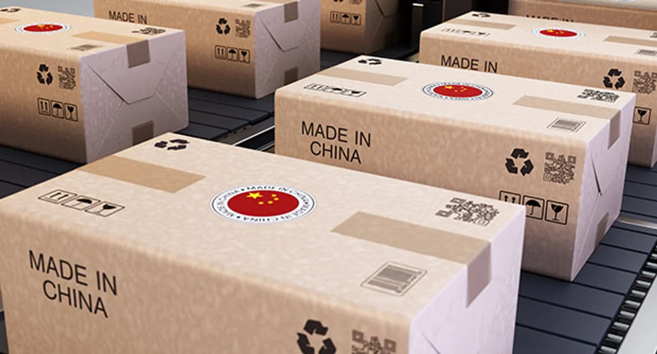 Shipping Boxes Marked With Chinese Symbols Stacked In A Warehouse For Distribution And Delivery