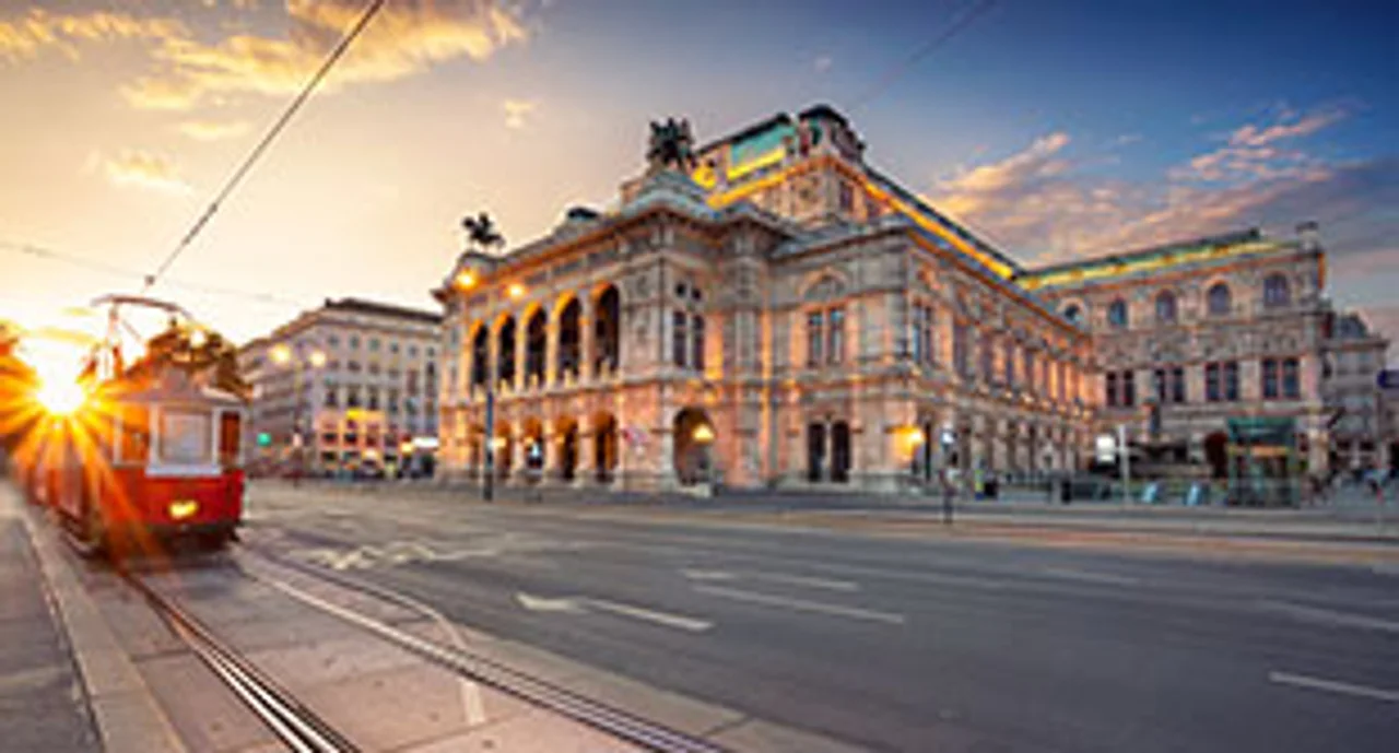 Cityscape image of Vienna with the Vienna State Opera during sunset.