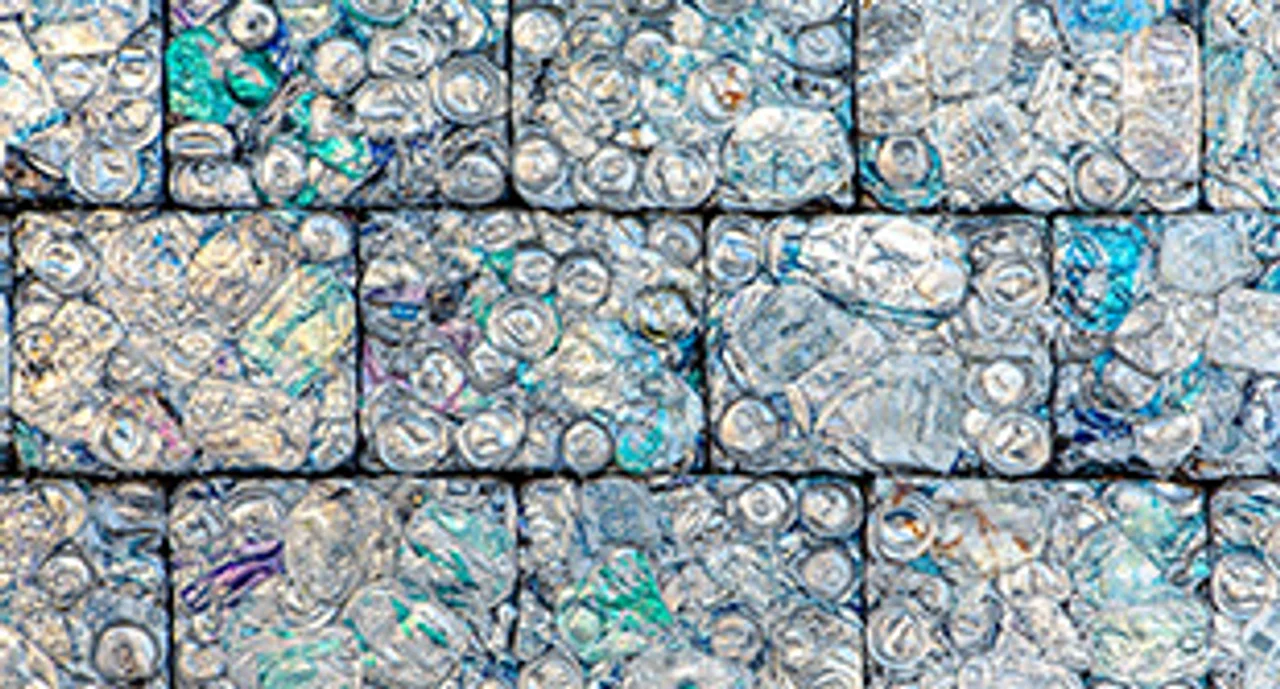 A wall of crushed aluminum cans recycled into building blocks