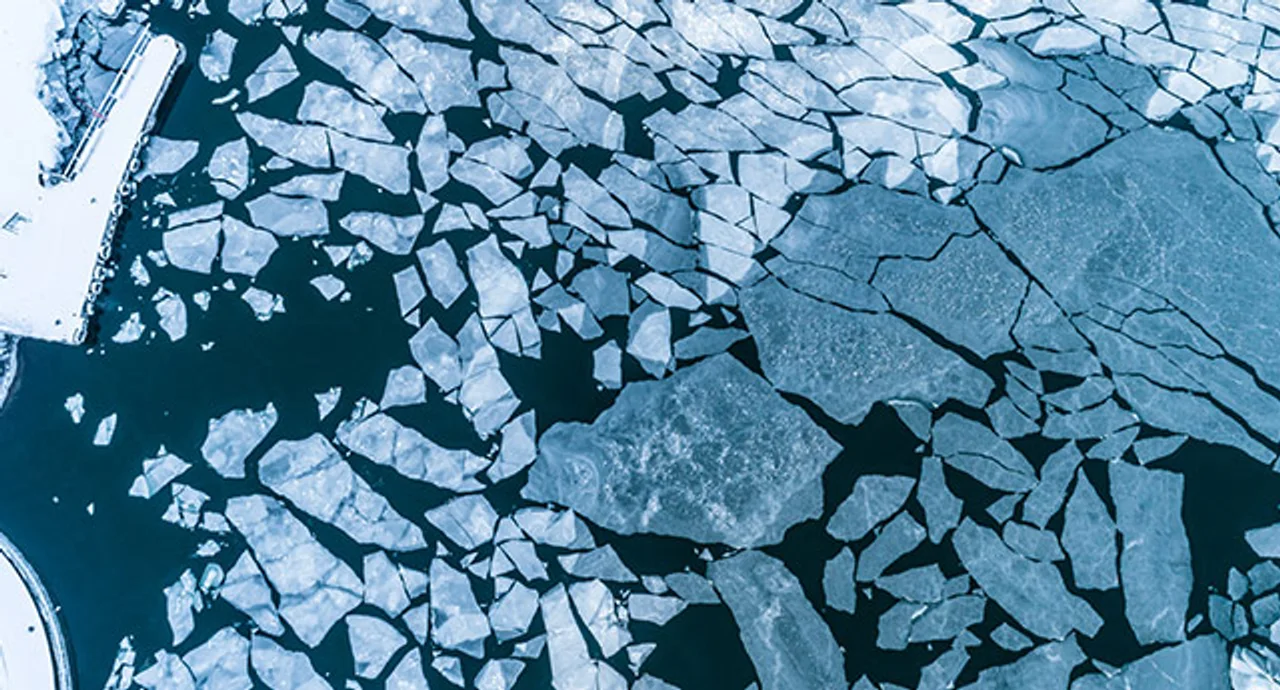 Big Cracked ice floe floating on baltic sea in Helsinki finland.
