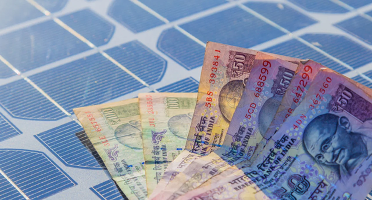 Indian Currency Note On Solar Panel In Day Light