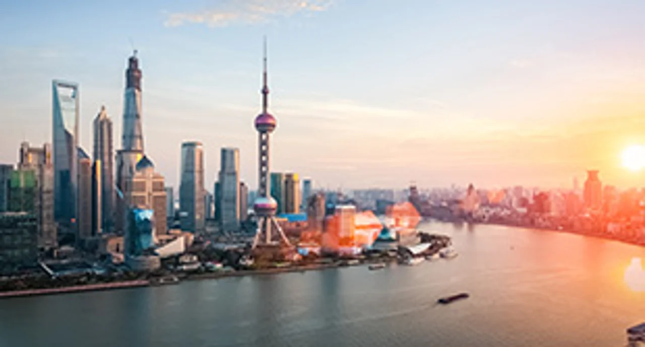shanghai at dusk, huangpu river and financial district skyline in sunset