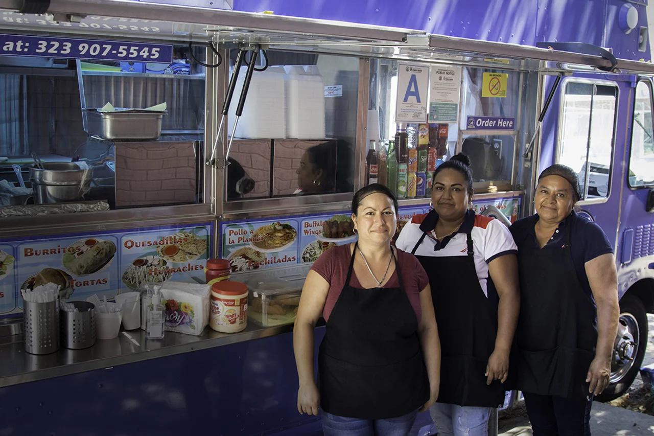 Small business owners with a food truck financed by Opportunity Fund