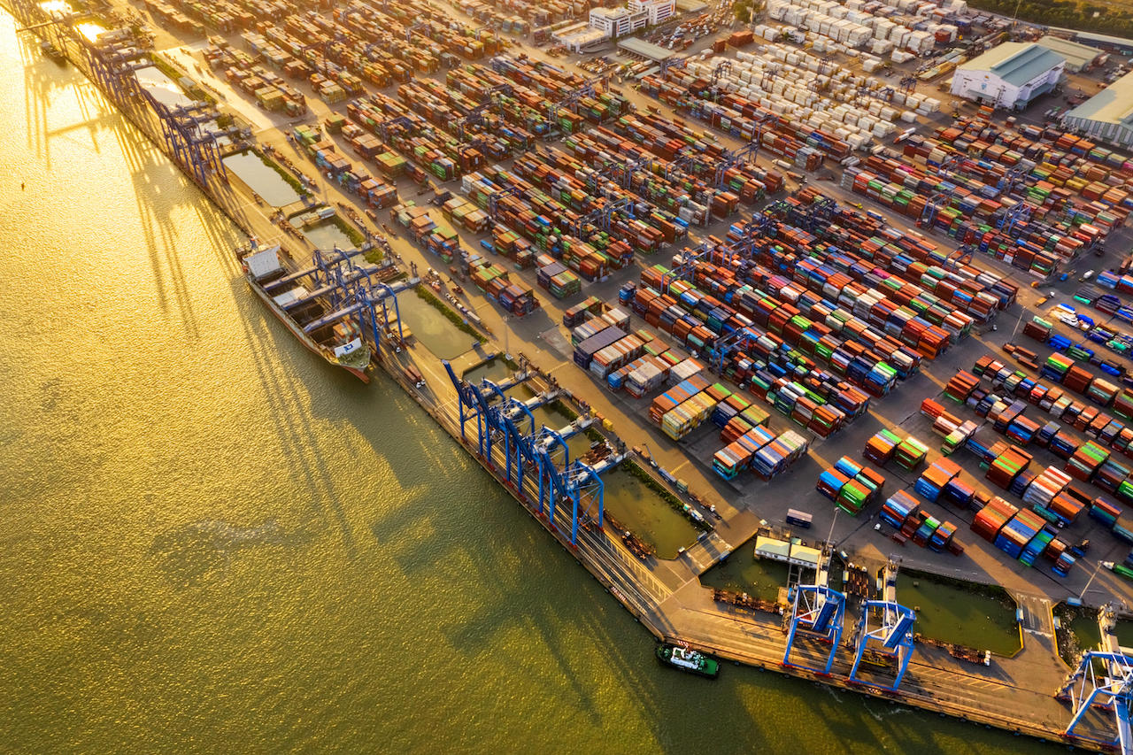 Top view aerial of Cat Lai port container, Ho Chi Minh City with development buildings, transportation, energy power infrastructure. Vietnam